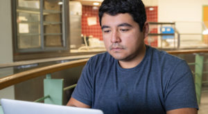 A student working on their laptop.