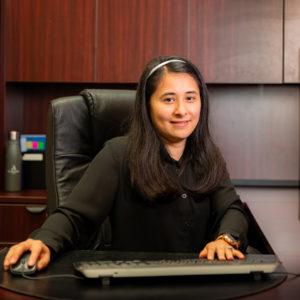 Hazel Roman at her desk.