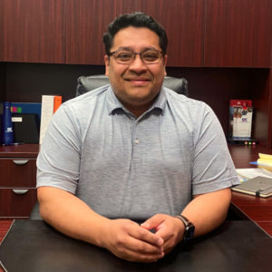 Ernesto Vazquez at his desk.