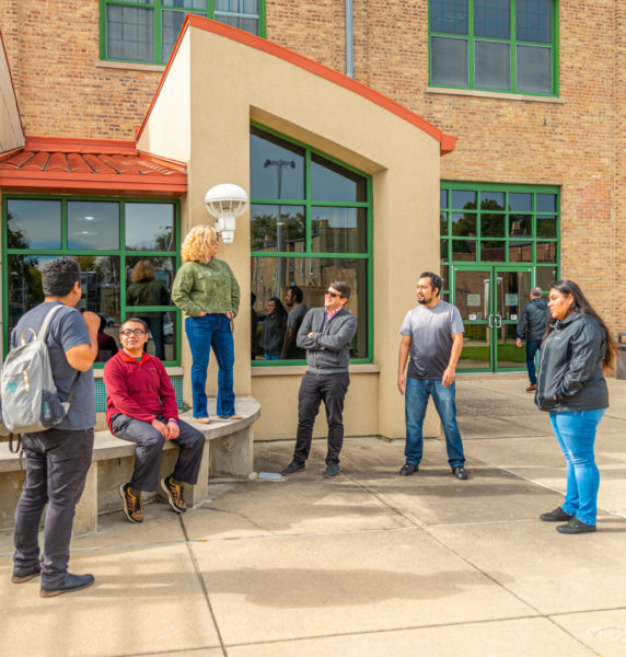 Students and faculty outside the main Saint Augustine College building.