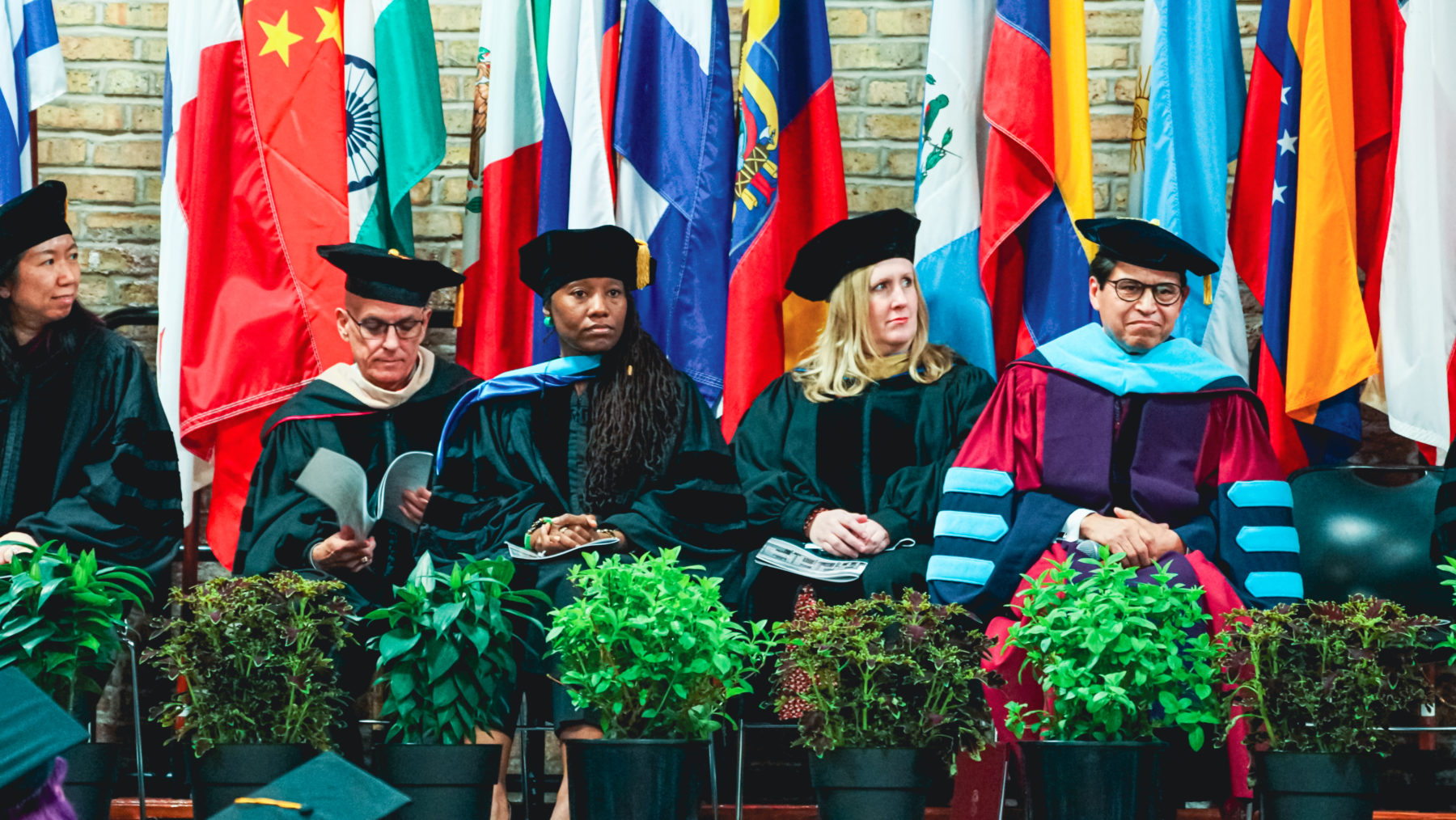 Professors waiting at commencement. 
