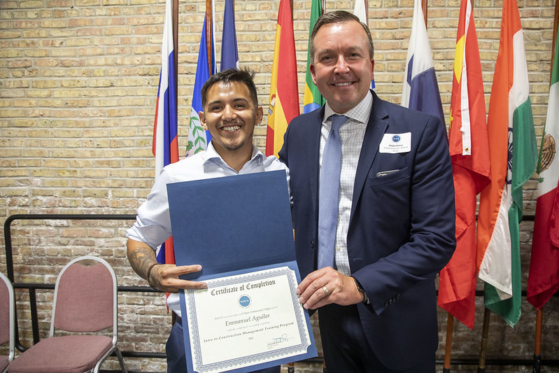 A HACIA graduate and his diploma 