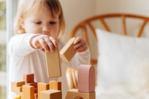 A young child playing with blocks.