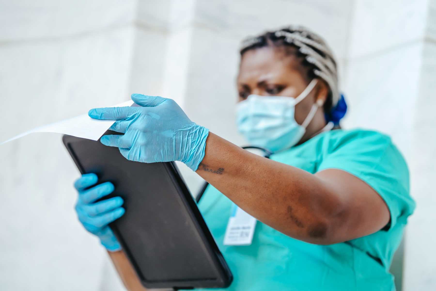  A medical worker examining a chart. 