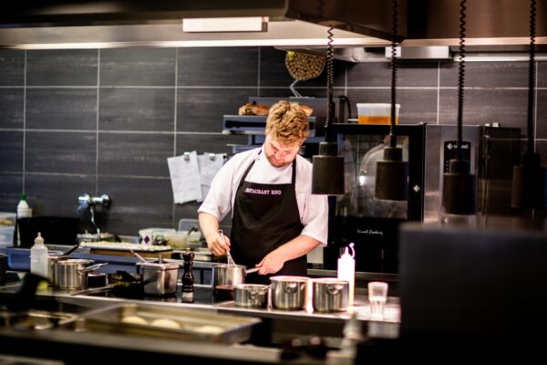 A chef preparing a sauce